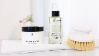 Sorella Body Balm and Body Nectar w/ body brush on towel