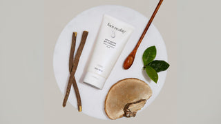 Face Reality Ultra Gentle Cleanser lifestyle photo with botanicals and wood