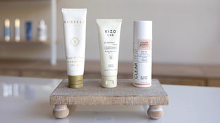 Lifestyle image-Sorella Quench & Protect-Kizo Lab Clear Sunscreen-Clearstem YouAreSunshine on a wooden block