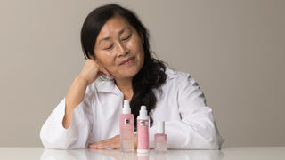 Woman spritzing with a  k-beauty mist that contains glutatione