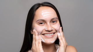woman washing her face