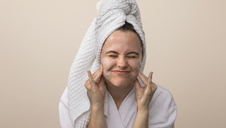Woman washing her face