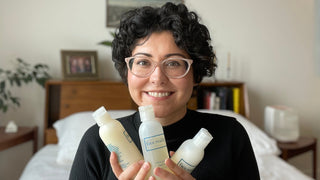 Celine holds several Face Reality Cleansers in her hands.