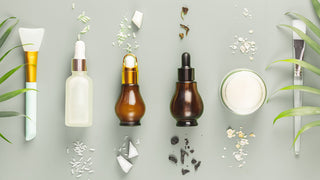 Skincare bottles with different ingredients spilling out