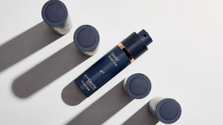 Five bottles of Skinbetter Alpharet Overnight Cream with shadows on a white background.