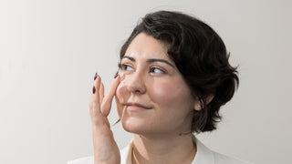 Woman touching her face