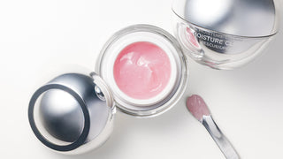 Open jar of Le Mieux Midnight Balm next to Le Mieux Moisture Cloud