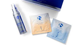 Is Clinical Active Peel Home Peel System packets with Is Clinical Retinol Emulsion bottle on white