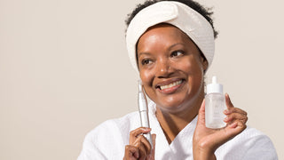 woman holding the Art of Skin Care Nano Infusion Pen and Epicutis Lipid Serum.