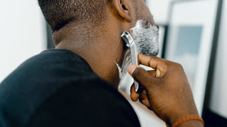 Man shaving with safety razor