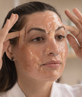 Woman applying CO2Lift Pro Carboxy Treatment Mask