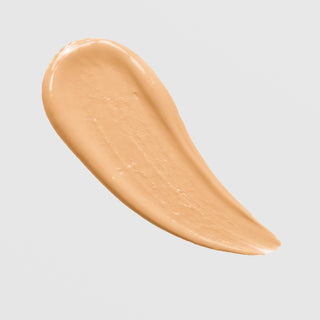 KrX Skin Filter Tinted Sunscreen SPF 50 PA++++ texture swatch in shade Light Medium on grey background.