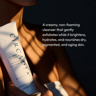 Hand holding Circadia Amandola Milk Cleanser in golden light — creamy non-foaming cleanser that brightens, hydrates, and nourishes dry, pigmented, and aging skin