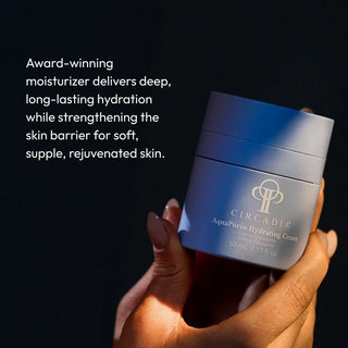 Hand holding Circadia AquaPorin Hydrating Cream jar, an award-winning moisturizer that delivers deep long-lasting hydration while strengthening the skin barrier for soft supple skin