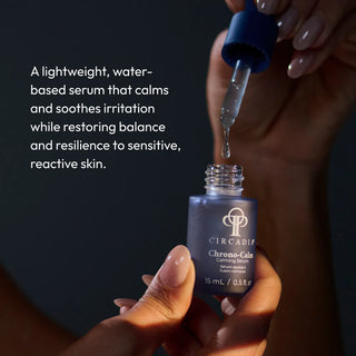 Hand dispensing Circadia Chrono-Calm Calming Serum from dropper bottle, a lightweight water-based serum that soothes irritation and restores resilience to sensitive and reactive skin