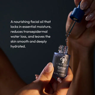 Hand dispensing Circadia Hydralox Hydrating Oil from dropper bottle, a nourishing facial oil that locks in moisture, reduces transepidermal water loss, and leaves skin smooth and deeply hydrated