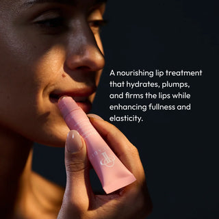 Woman applying Circadia Lip Renewing Hydrator in Hibiscus, a nourishing lip treatment that hydrates, plumps and firms
