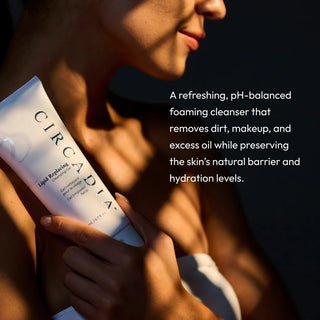 Woman holding Circadia Lipid Replacing Cleansing Gel tube, a refreshing pH-balanced foaming cleanser that removes dirt makeup and excess oil while preserving the skin barrier and hydration