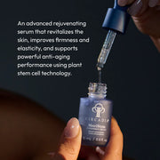 Hand holding Circadia MeriStem Antioxidant Serum 15ml navy bottle with dropper dispensing serum — advanced plant stem cell serum that revitalizes skin, improves firmness, and supports anti-aging