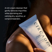 Hand holding Circadia Nourish Cream Cleanser in warm light — rich cream cleanser that gently removes impurities while nourishing and calming dry, sensitive, or compromised skin