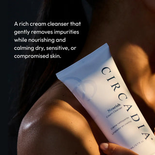 Hand holding Circadia Nourish Cream Cleanser in warm light — rich cream cleanser that gently removes impurities while nourishing and calming dry, sensitive, or compromised skin