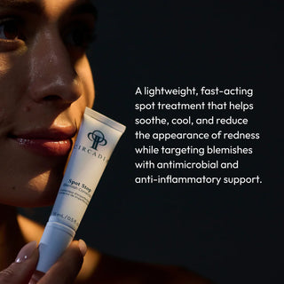 Circadia Spot Stop Blemish Corrector held next to the face on a dar background.