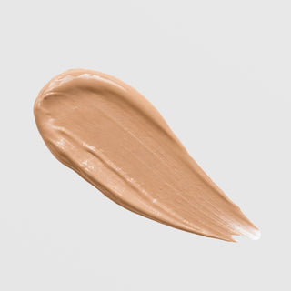 KrX Skin Filter Tinted Sunscreen SPF 50 PA++++ texture swatch in shade Medium Dark on grey background.