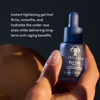 Hand holding Circadia Eye Lift Serum dropper bottle, an instant tightening gel that firms, smooths, and hydrates the under-eye area while delivering long-term anti-aging benefits