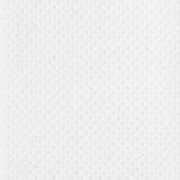 Close-up of a single Art of Skin Care Luxe Toner Pad showing its soft white dotted texture, displayed against a white background.