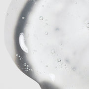 Close-up of Hale & Hush Sensitive Skin Specialist Quiet Wash showing a lightweight clear gel cleanser texture with bubbles on a light gray background