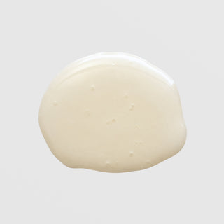 BiON Brightening Renewal Complex – texture swatch showing fluid ivory lotion consistency for skin brightening and even tone