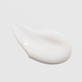 Smooth white cream texture swatch of ALASTIN INhance Post-Injection Serum
