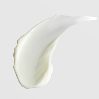 Rich cream texture swatch of ALASTIN Ultra Calm Cleansing Cream on light background