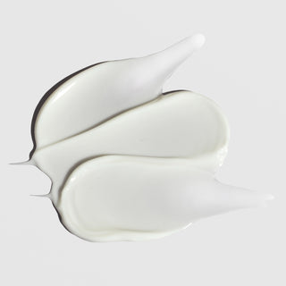Light cream texture swatch of ALASTIN Ultra Light Moisturizer on light background