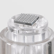 Close-up of Art of Skin Care nano infusion cartridge tip showing precision micro-point needle array on clear cartridge