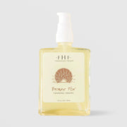 Farmhouse Fresh Bronze Fox Tanning Drops (4 fl oz / 118 ml) in a clear glass pump bottle with a pale yellow formula visible inside, featuring a cream label with a bronze sunburst illustration, displayed against a light gray background.