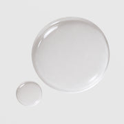 Circadia Eye Lift Serum texture swatch showing clear lightweight gel drops with a glossy, water-like consistency