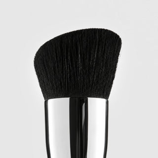 Close-up of Colorescience Angled Face Brush dense soft angled black bristles and silver ferrule