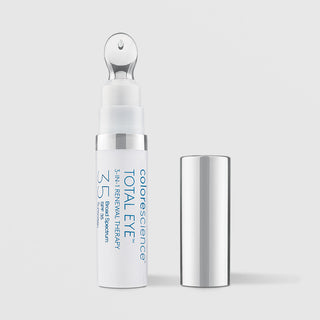 Colorescience Total Eye 3-in-1 Renewal Therapy SPF35 white pen with glass ball applicator tip exposed and silver cap beside it
