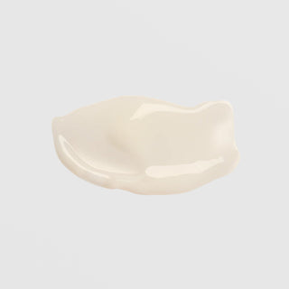 Colorescience Even Up Multi-Correction Serum texture swatch showing lightweight creamy white formula on grey background.