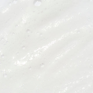Close-up of Corthe Dermo Essential Foaming Gel Cleanser showing a lightweight, creamy white foam texture