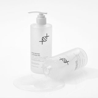 Dermathod Derma Revive Cleansing Gel two 300mL clear pump bottles, one upright and one tipped with gel spilling, hypoallergenic pH-balanced formula on white background