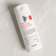 Dr. esthé Enzyme Deep Clear Powder Wash 1.76 oz (50g) - white cylindrical bottle with red label, papain and allantoin formula for oily and blemish-prone skin