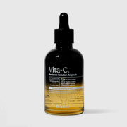 Dr.esthé Vita-C Radiance Solution Ampoule 150ml amber glass dropper bottle with 72% lemon water, 14% vitamin complex, Alpha-Melight formula, and 5000ppm goat milk for advanced brightening
