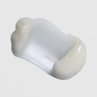 Close-up of Epicutis Lipid Body Treatment showing a rich, glossy white cream texture on a light gray background
