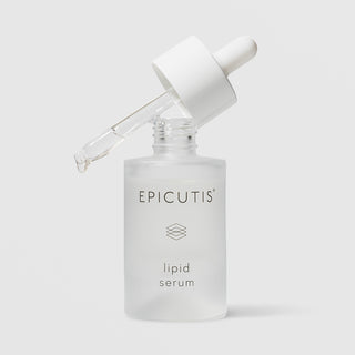 Epicutis Lipid Serum in a frosted glass bottle with dropper resting open at an angle on a light gray background