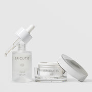 Epicutis Lipid Serum dropper bottle and Hyvia Crème open glass jar luxury skincare set with lid off, on a light gray background