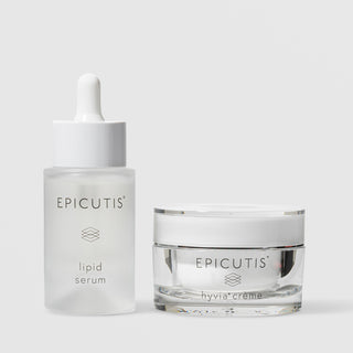 Epicutis Lipid Serum dropper bottle and Hyvia Crème closed glass jar luxury skincare set, on a light gray background