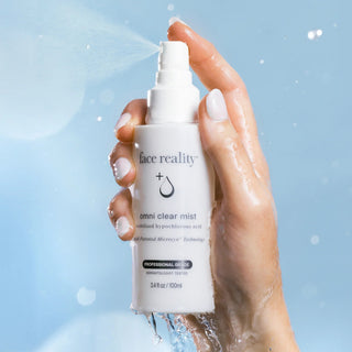 Face Reality Omni Clear Mist hypochlorous acid facial spray being spritzed, professional grade acne-prone skin mist