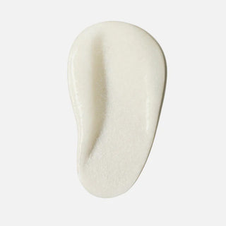 Face Reality Acne Face and Body Scrub texture swatch – thick creamy white exfoliating formula on light gray background